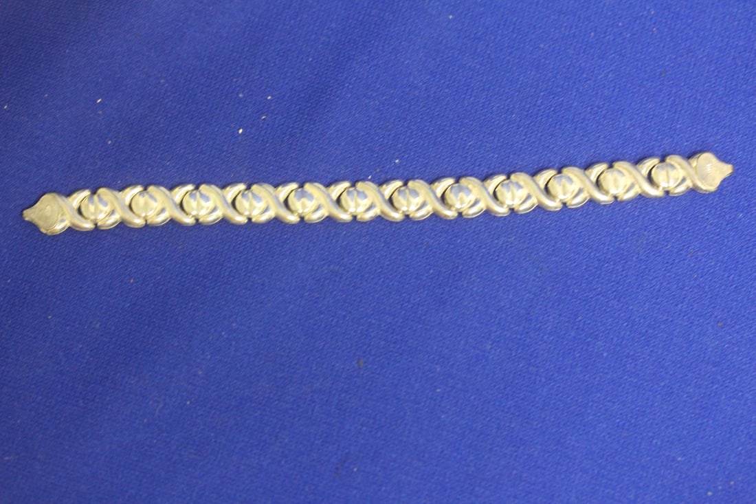 A Sterling Bracelet: 6 5/8" across unclasped