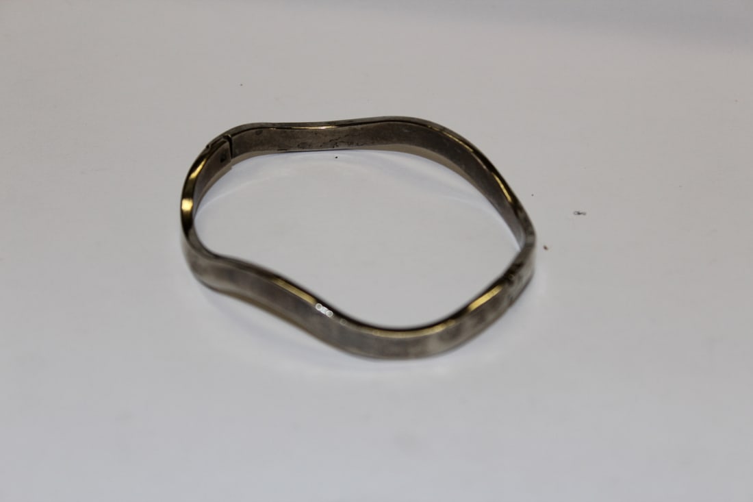 A Sterling Bangle Bracelet: as shown