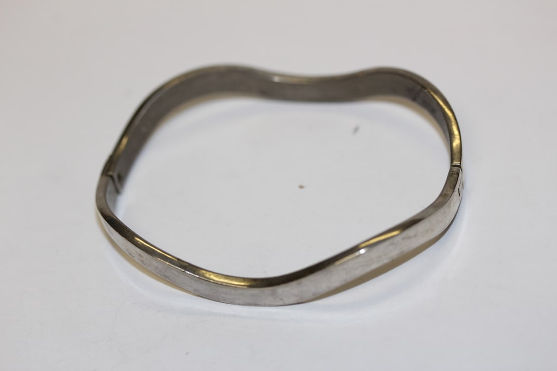A Sterling Bangle Bracelet: as shown