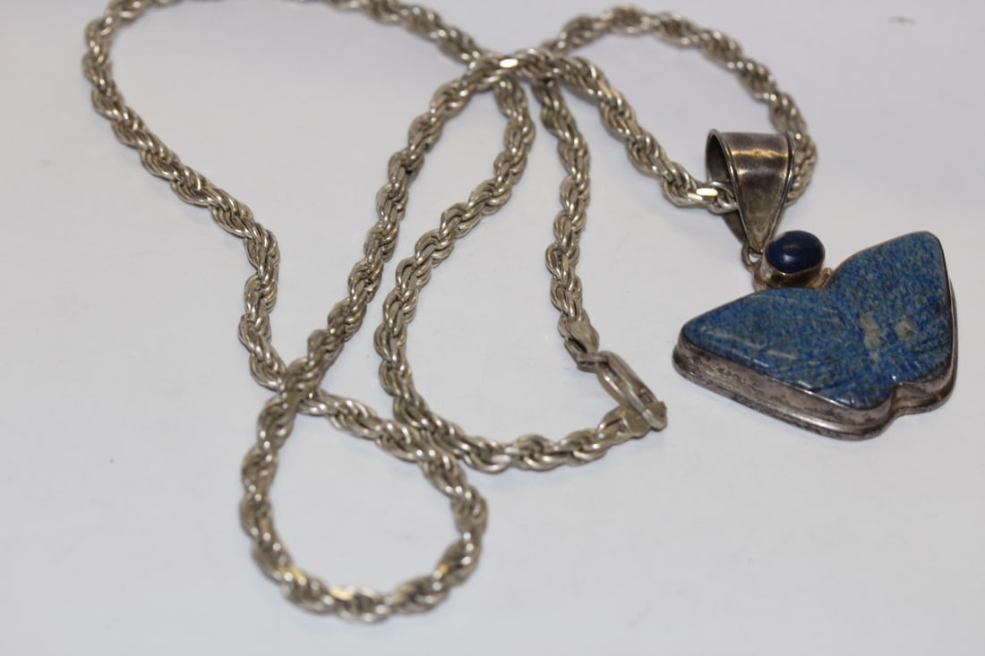 A Sterling Necklace and Lapis Lazuli Pendant: butterfly - marked .925 Italy - marked PGDA - measures 15" clapsed including the pendant - 13" long unclapsed only the necklace