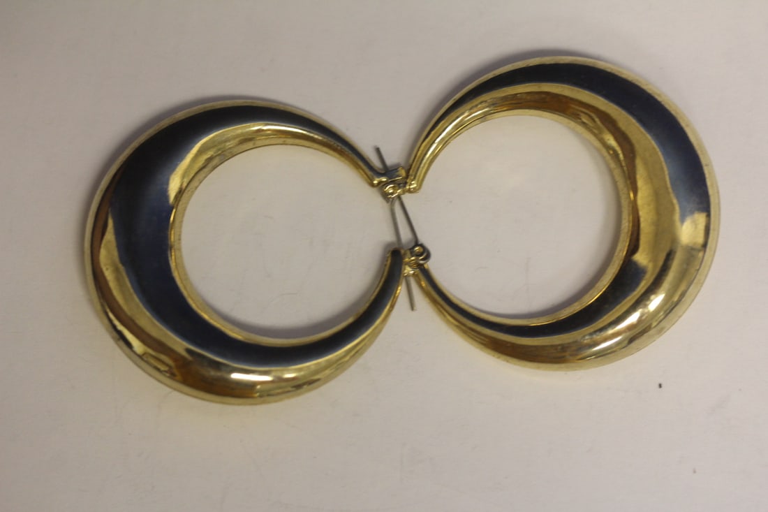 A Pair of Costume Earrings: as shown