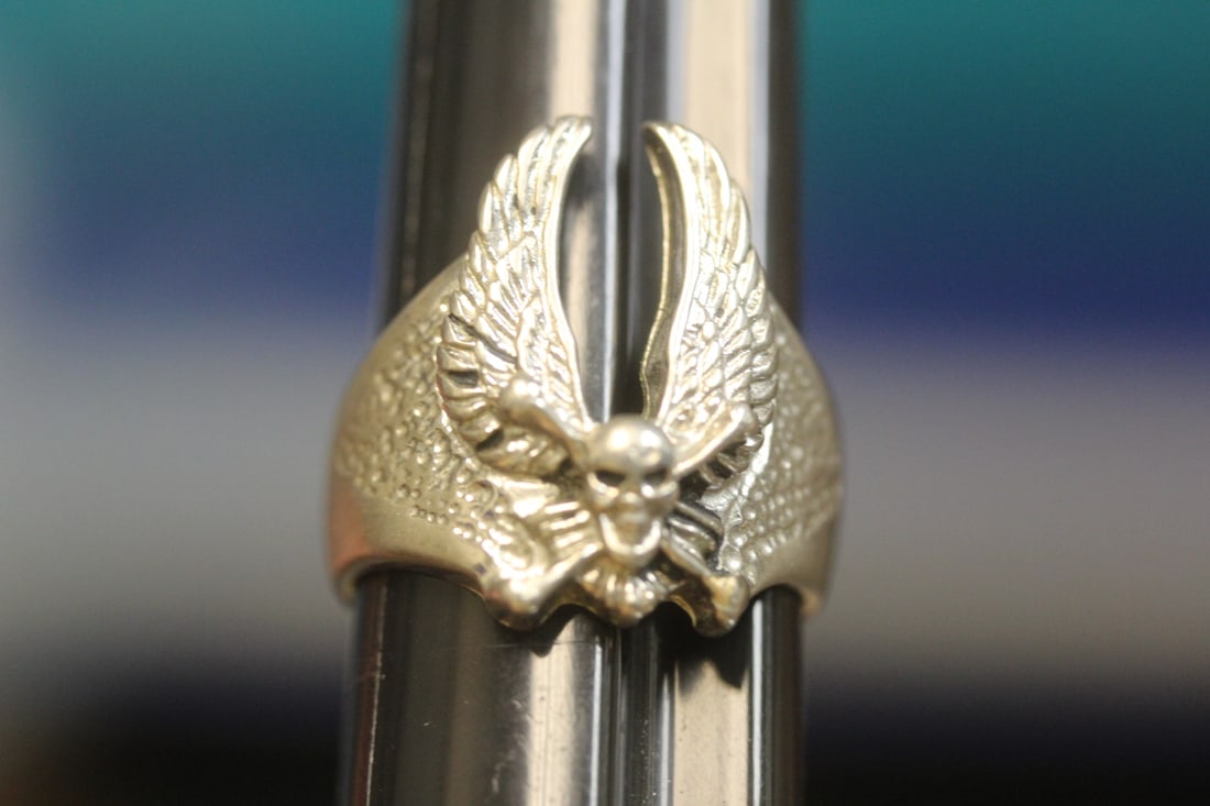 Skull ring: size 9, metal, content unknown