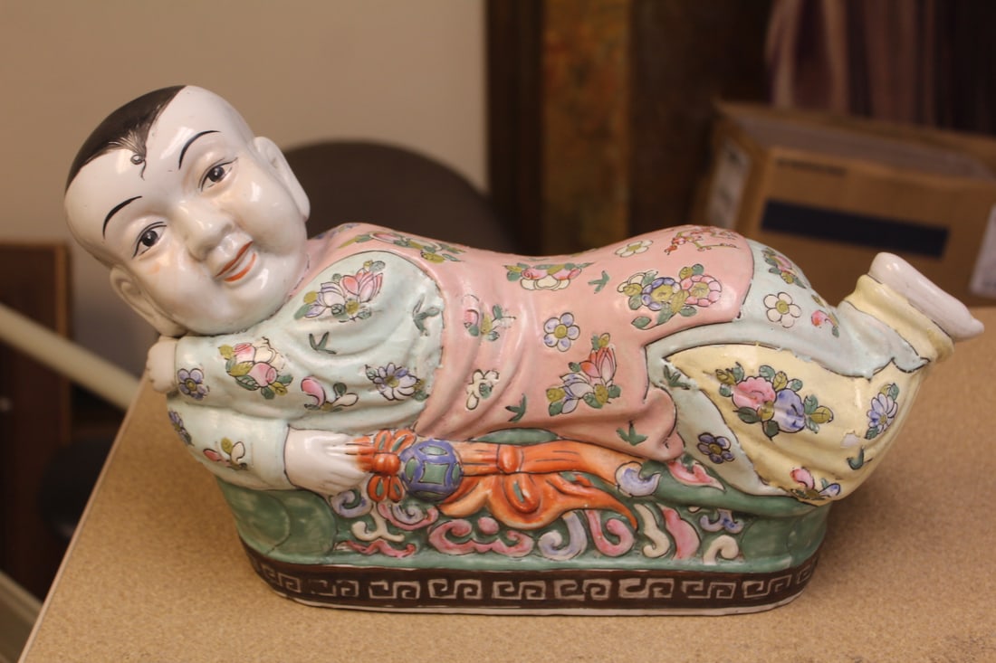 Chinese Ceramic Pillow: in form of a reclining boy - 14 1/2" across