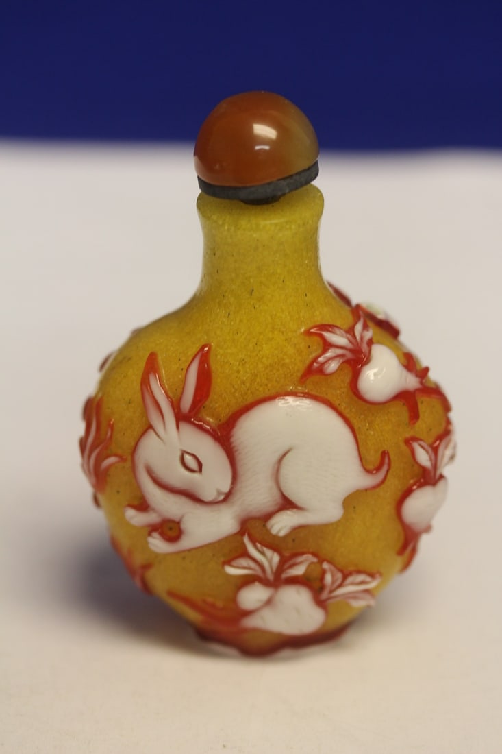 Glass Snuff Bottle: snow storm yellow overlay - please note: top of stopper broken off - 3 inches tall