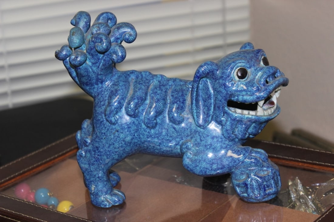 A Chinese Robins Egg Glazed Foo-Lion: Possibly old - there seems to be a restoration on one of the tail - measures 8" wide