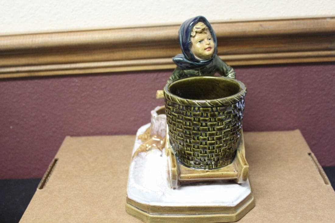 A Signed Pottery Figurine: 8 inches wide