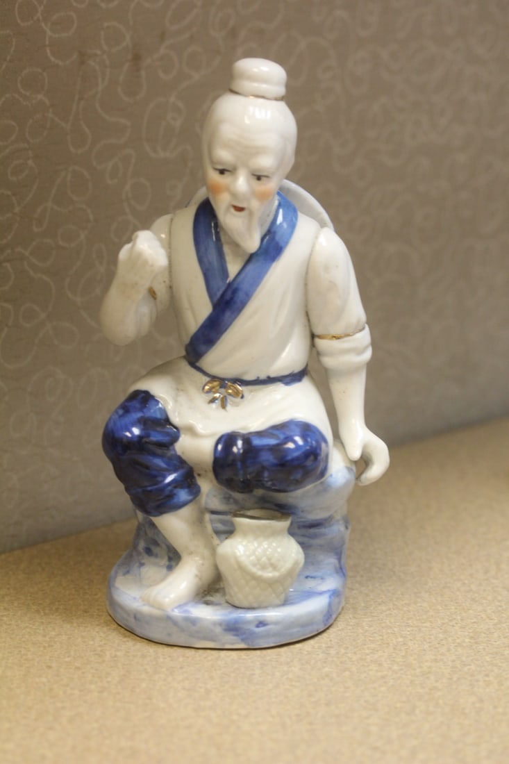 Oriental Fisherman: please note: missing fishing pole, chip by the fist as shown - 8 1/2" tall