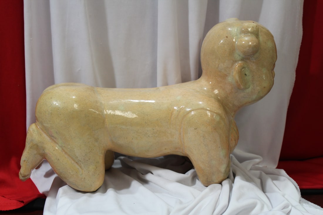 An Antique/Vintage Chinese Kneeling Boy: please note: chip on the knee - approximately 14 1/2" across