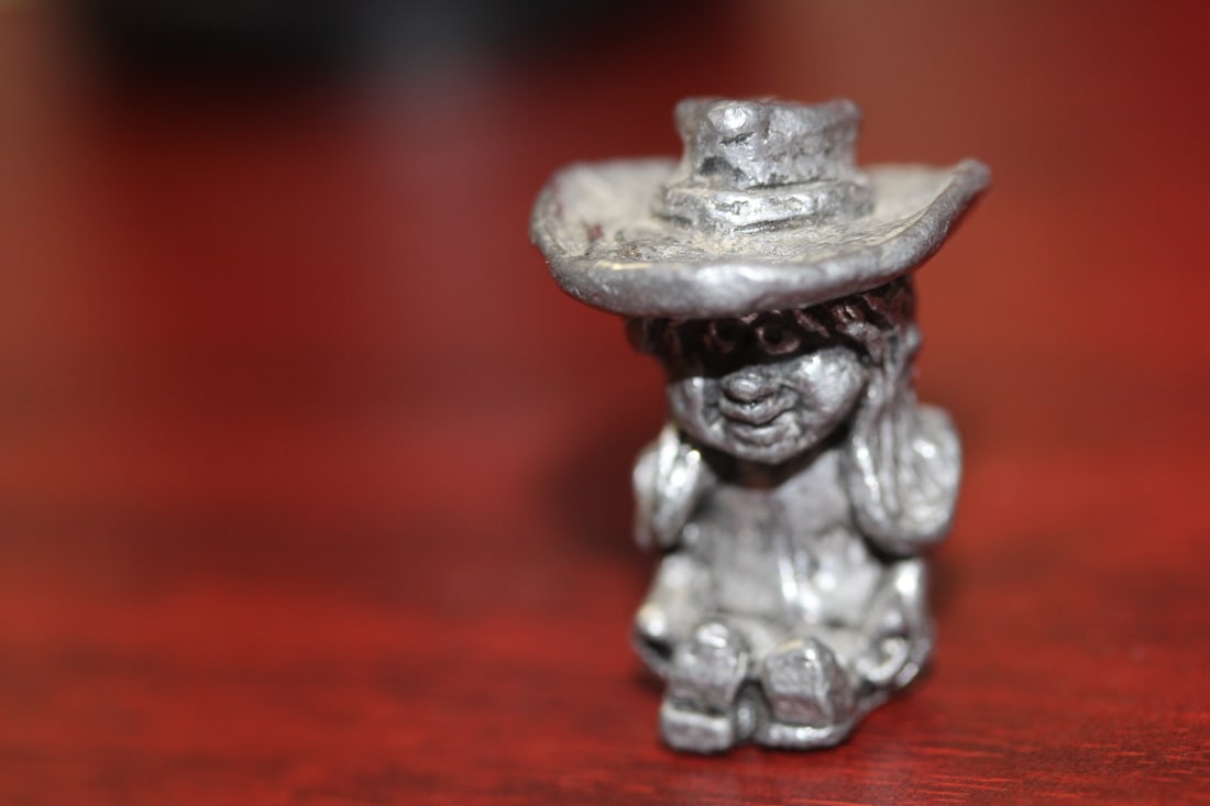 A Small Pewter Cow Girl: 1 3/8" tall