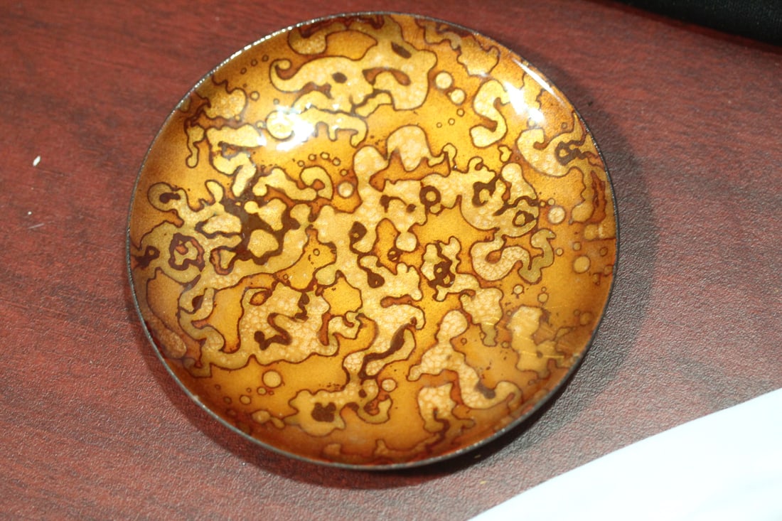 A Small Enamel Plate: marked on the bottom - 4 1/4" in diameter