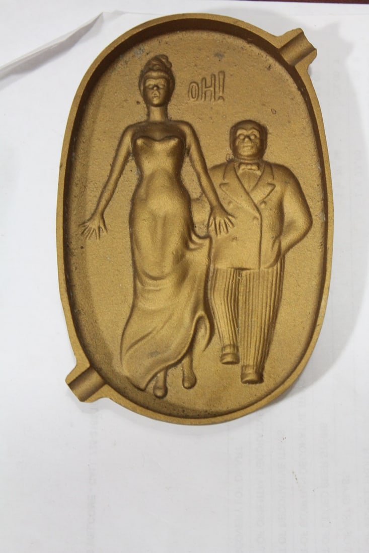 A Naughty Metal Ashtray: 5 1/2" across