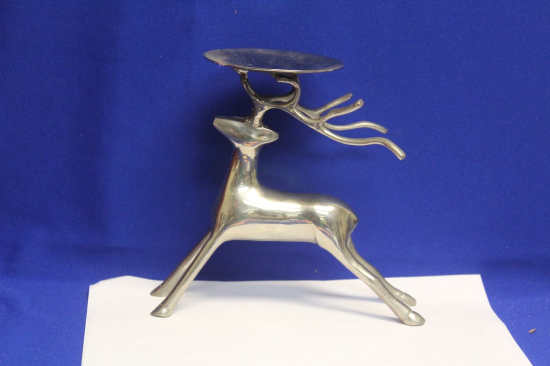 A Metal Deer Candle Holder: 7" wide x 7" tall