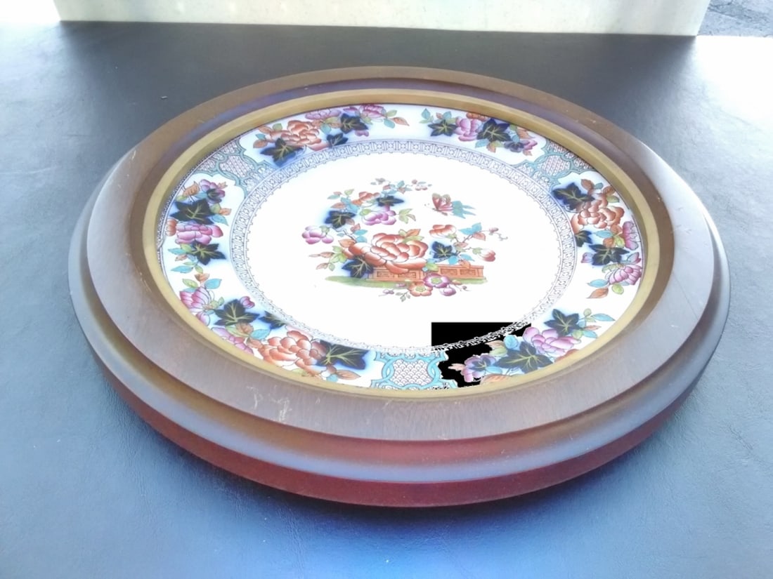 An Antique Flow Blue Ironstone Pottery Plate: Mounted in a wooden round frame - Overall= 13 1/2 inches in diameter - 19th century