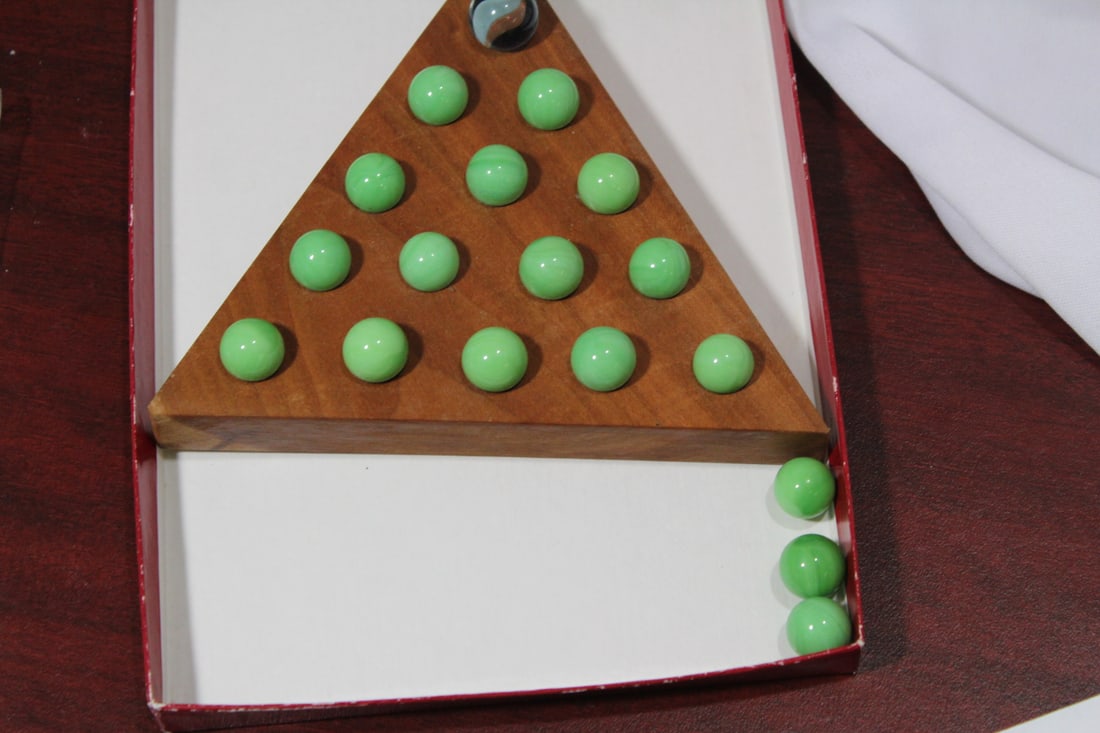 A Triangular Peg Solitaire Game: each side measures 5 7/8" across