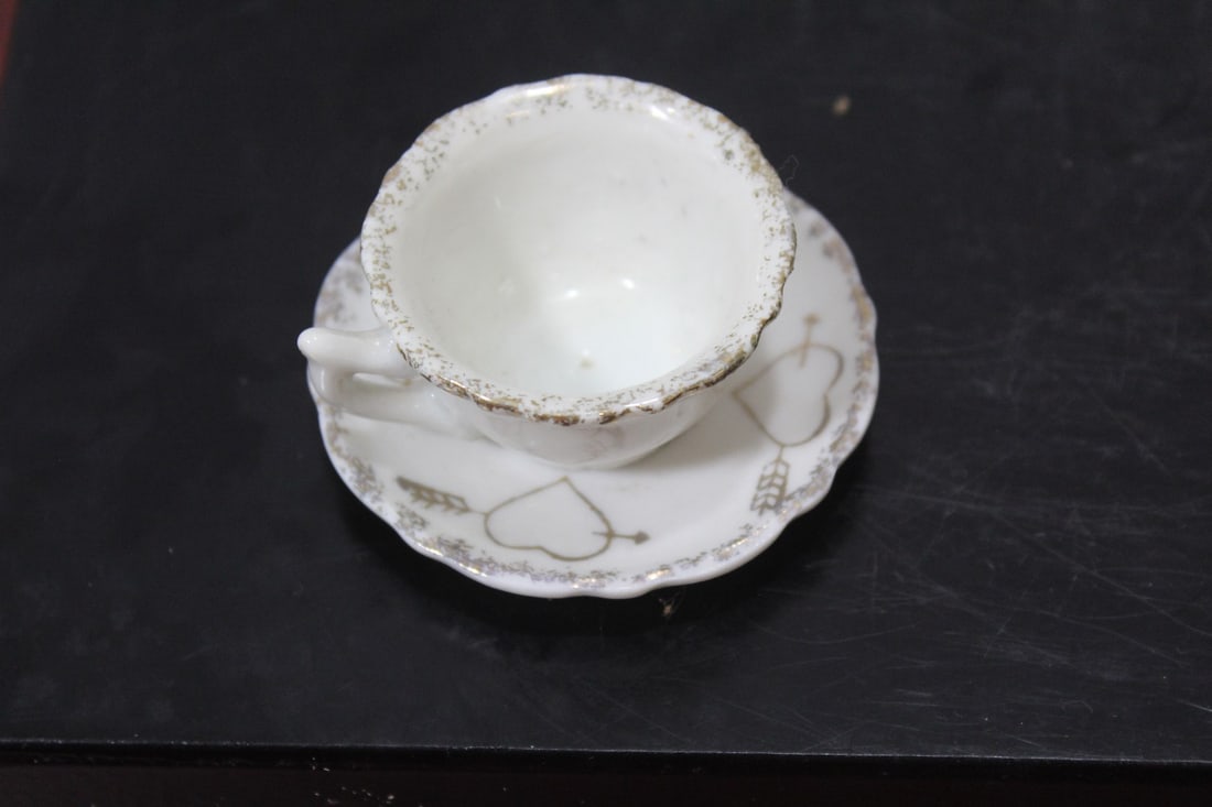 A Miniature Ceramic Cup and Saucer (1 of 5)