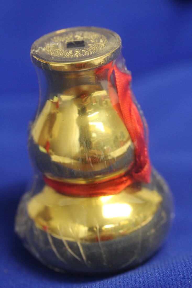 A Metal Guard: still sealed - 3 inches tall