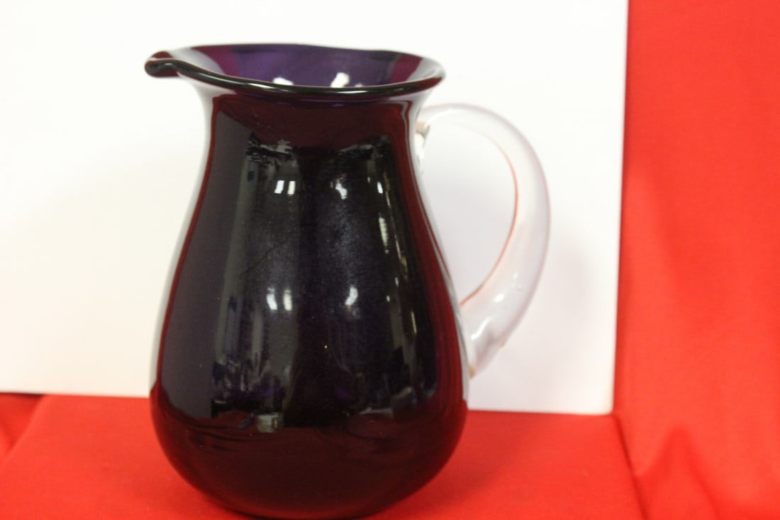 An Amethyst Glass Pitcher: 7 1/8" tall