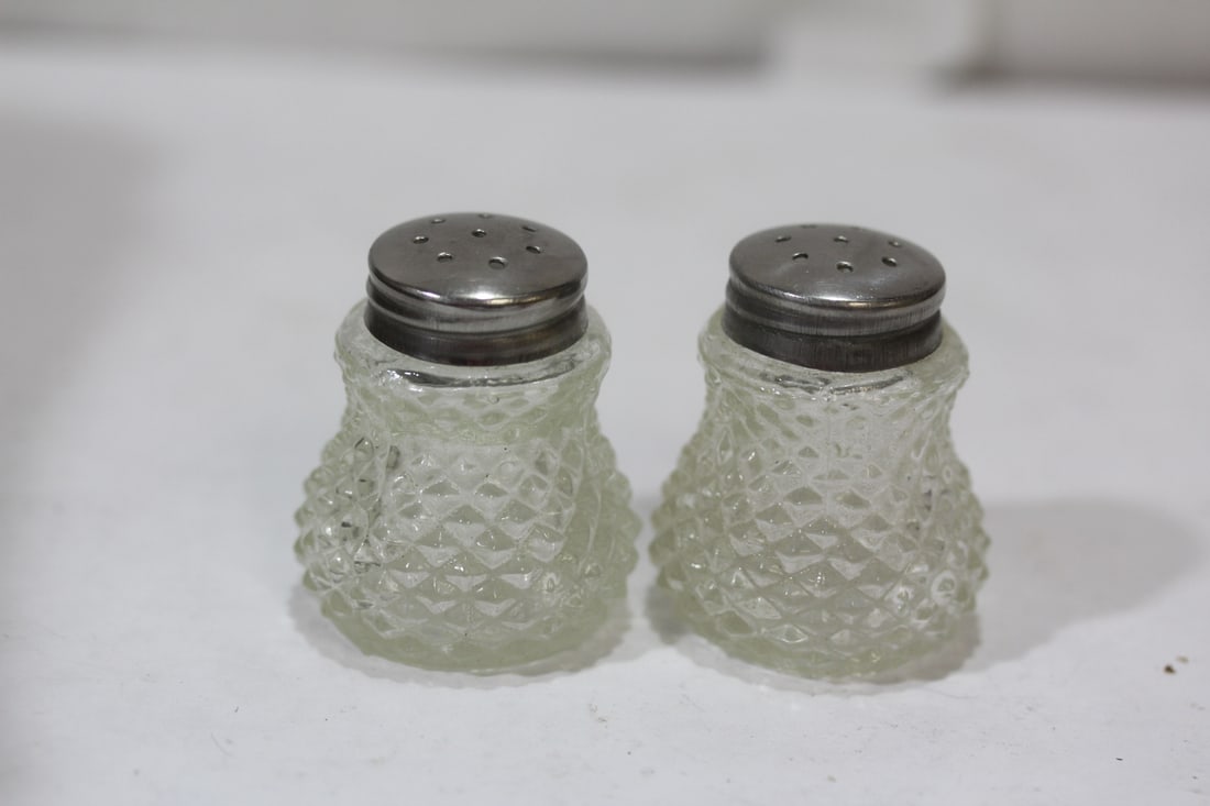 A Pair of Salt and Pepper Shakers: 1 3/4" tall each