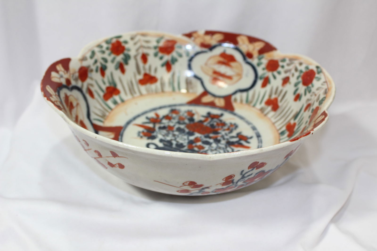 A Japanese Imari Bowl: 9 3/4" in diameter - please note: hairline
