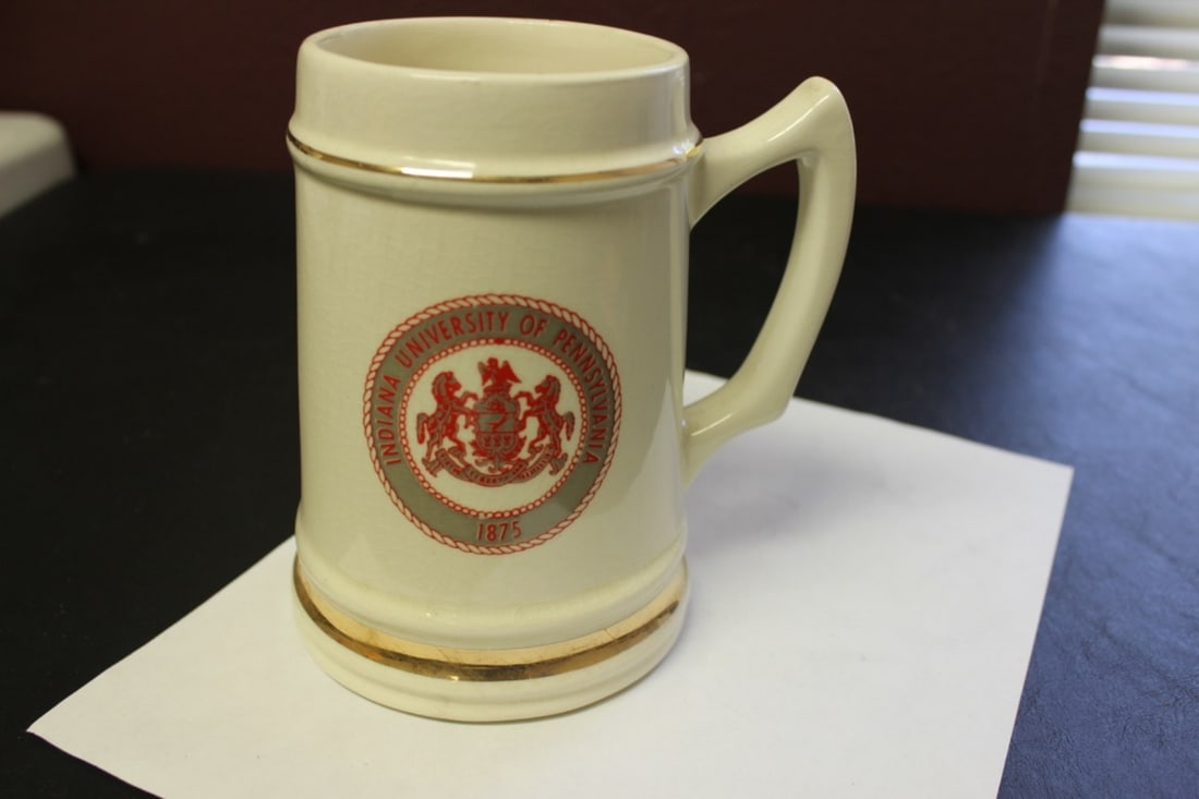 An Indiana University Of Pennsylvania Stein: 6 3/8 inches tall