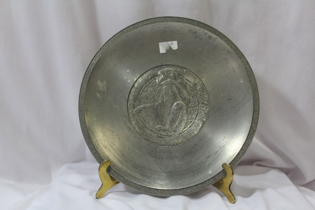 A Chinese Pewter Monkey Wall Hanger: 8" in diameter