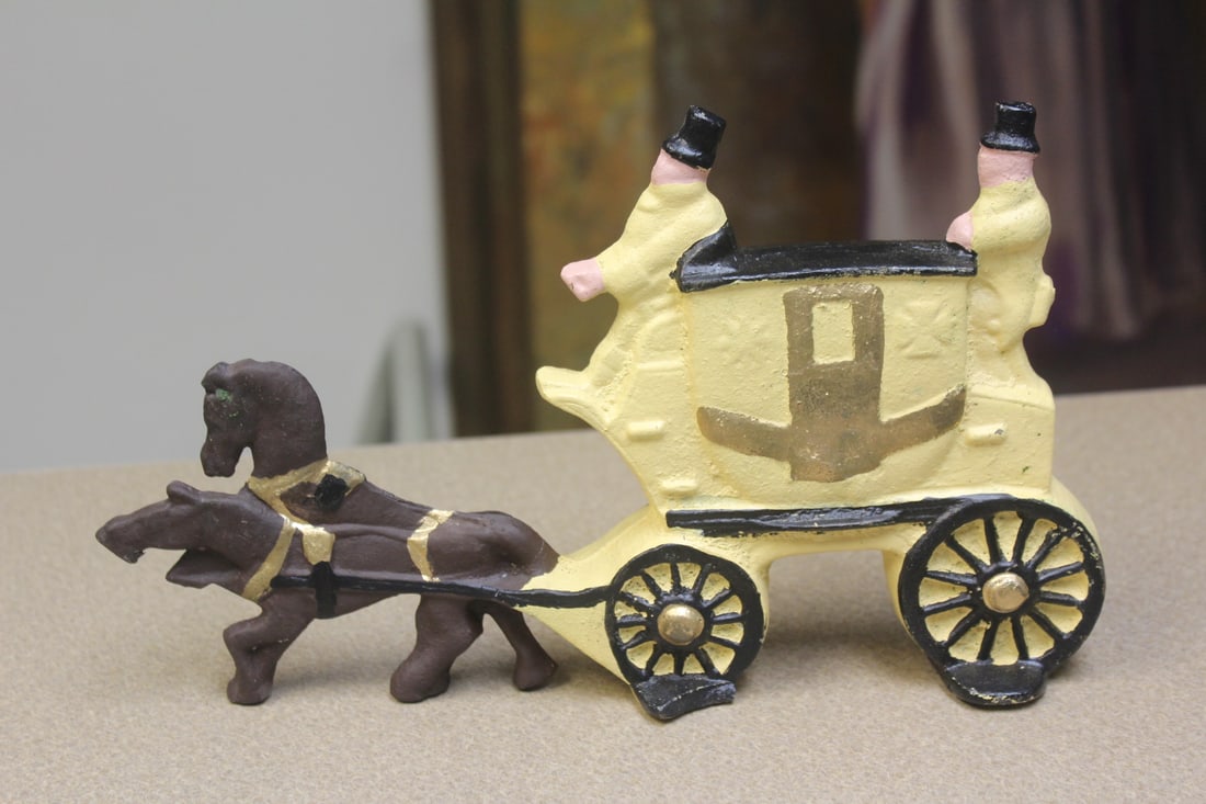 Cast iron door stopper: Heavy, 11 3/8" across