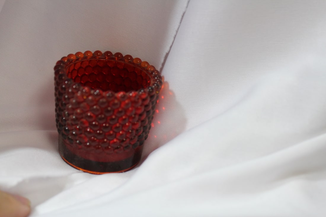 A Ruby Red Glass Cup: 2" tall