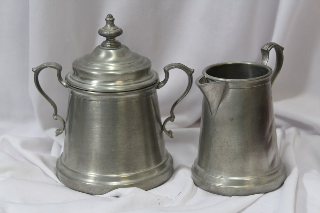 A Silverplated Creamer and Sugar Container: please note: dents as shown - taller= 5 3/4"