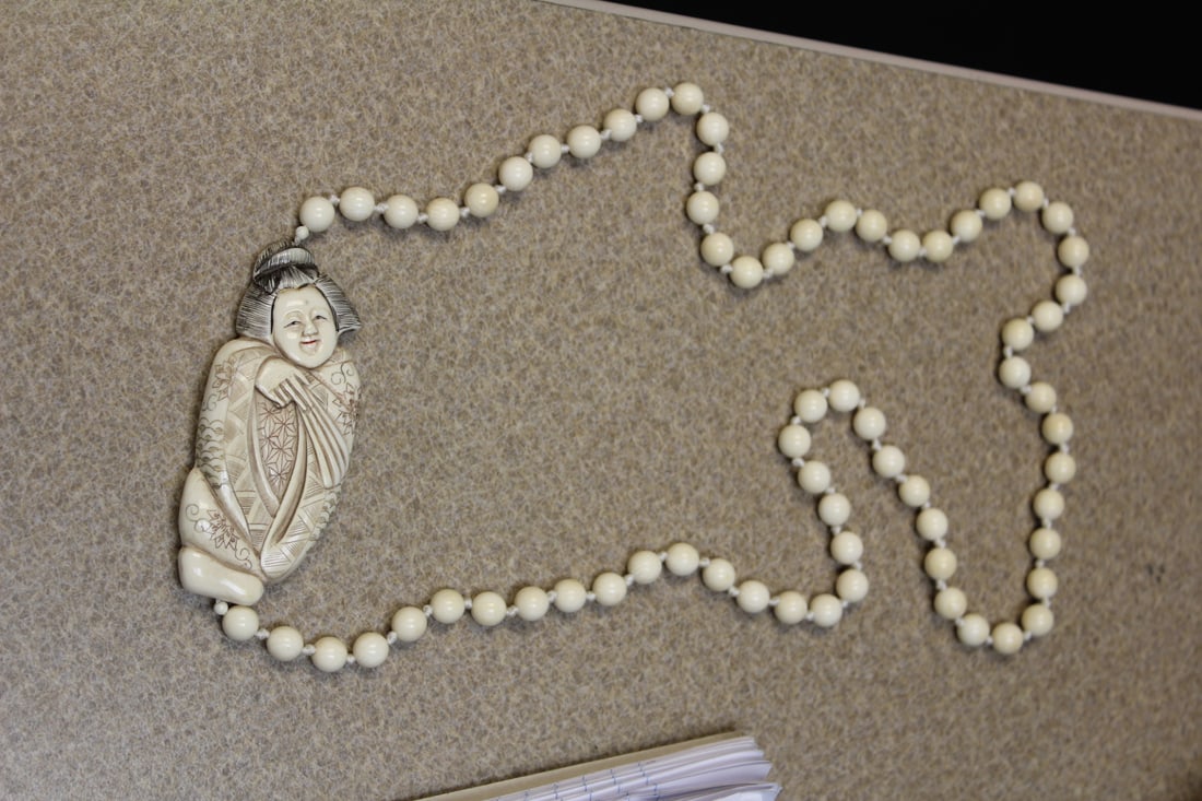 Japanese Signed Bone Necklace: approximately 14 inches long - well carved - signed on two places