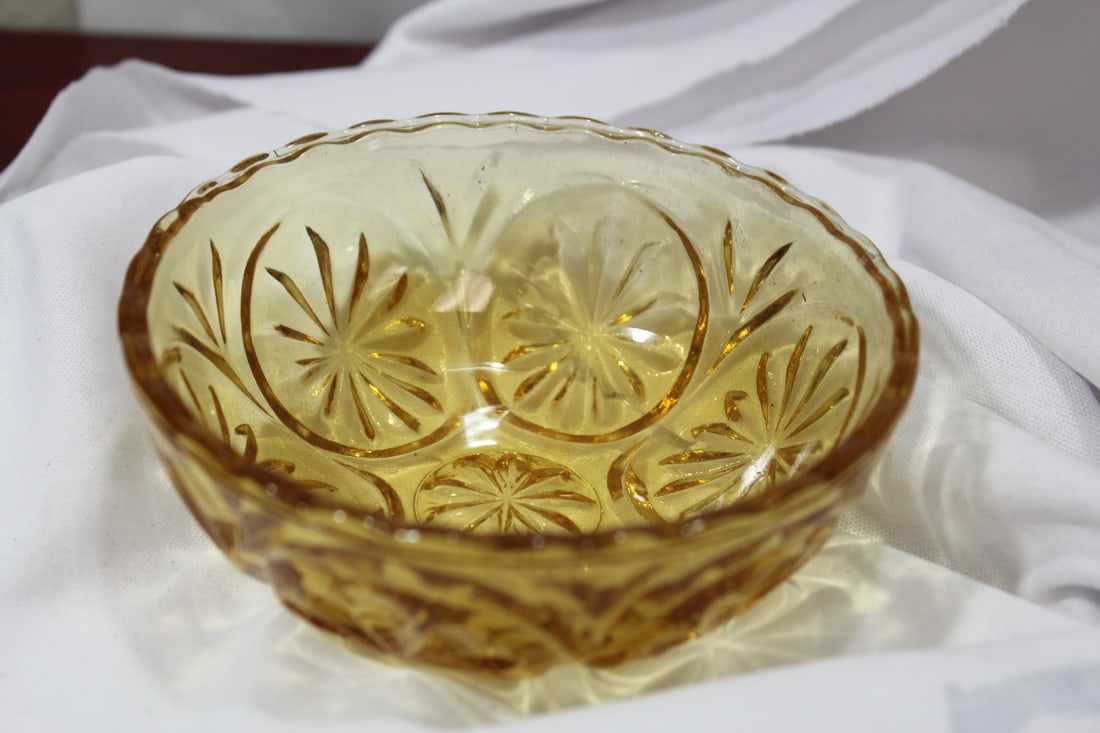 An Amber Pressed Glass Bowl: 4 1/2" in diameter