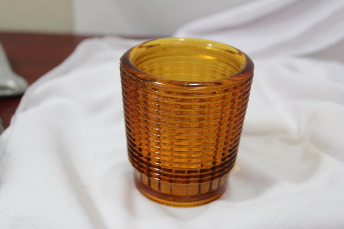 An Amber Glass Cup: 2 5/8" tall