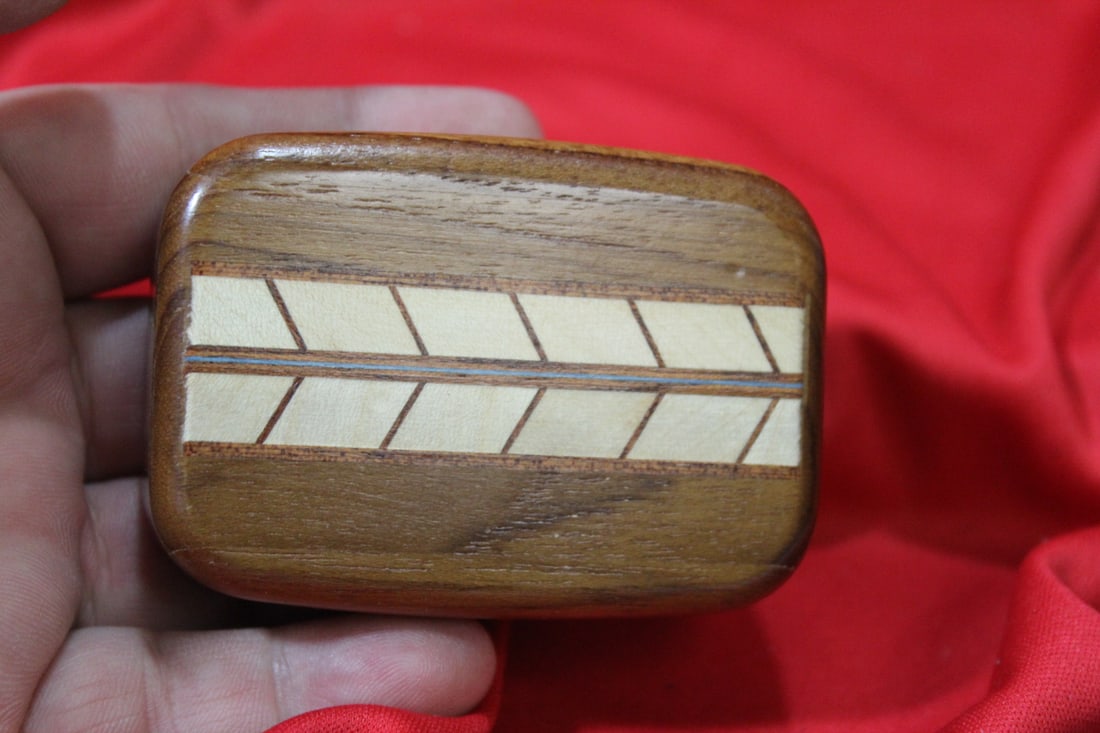 An Inlaid Wooden Slide Trinket Box: 3" across