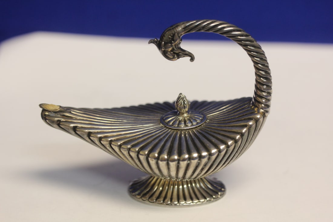 A Sterling Gennie Lamp: 3 5/8" across