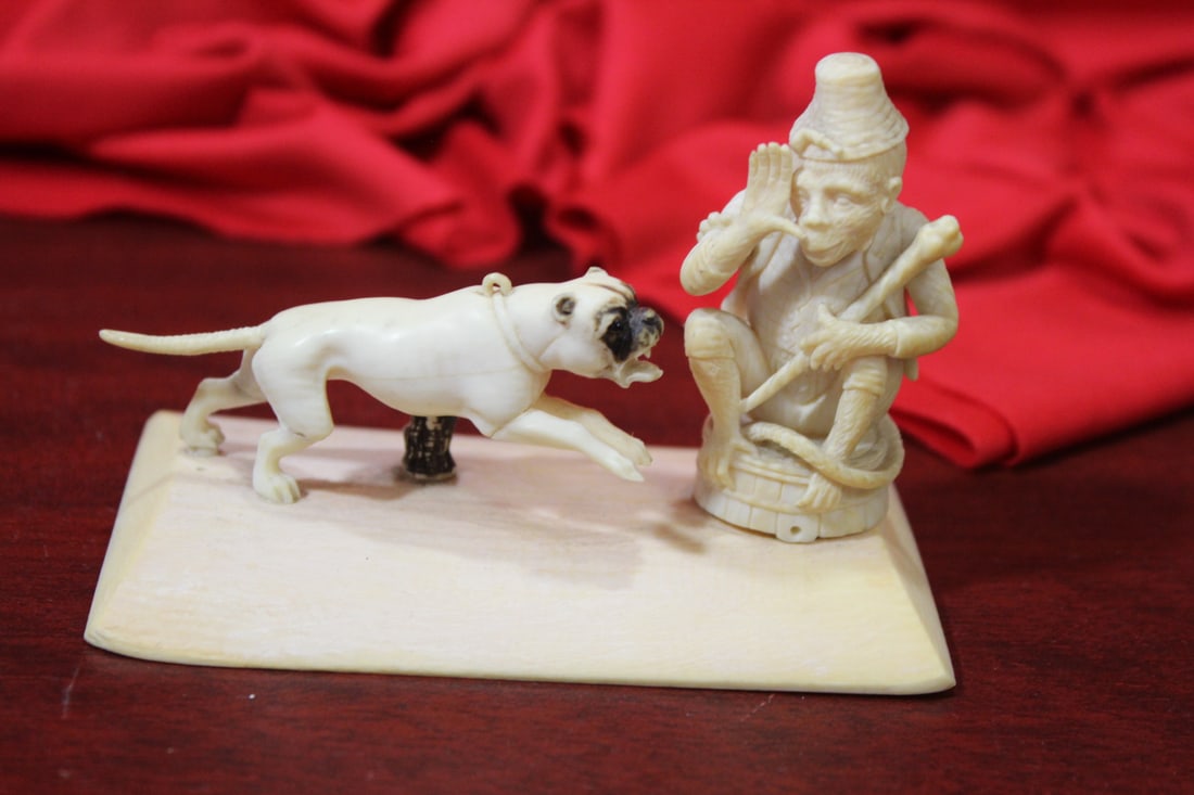 A Very Well Carved Bone Monkey and Bone Group: 19th century/ early 20th century - country of origin is unknown - 3 7/8" across