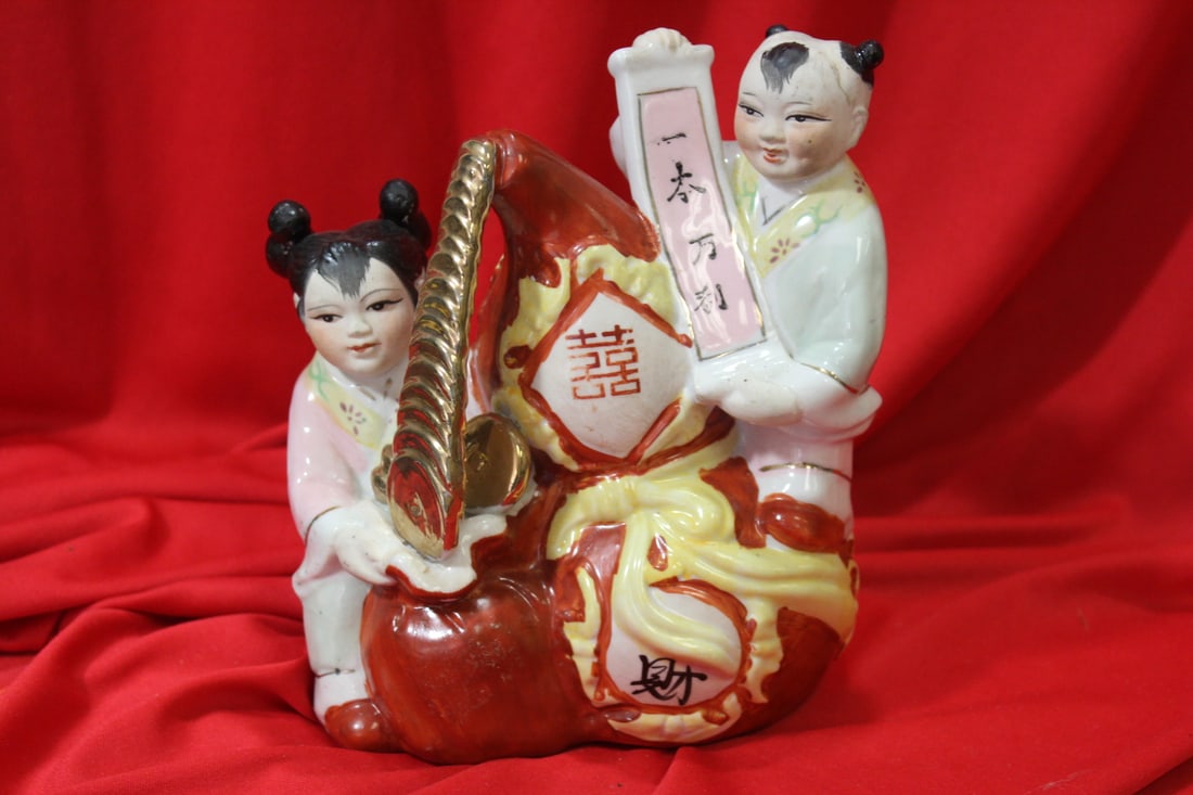 A Chinse Boy and Girl Figurine: 7 1/4" tall