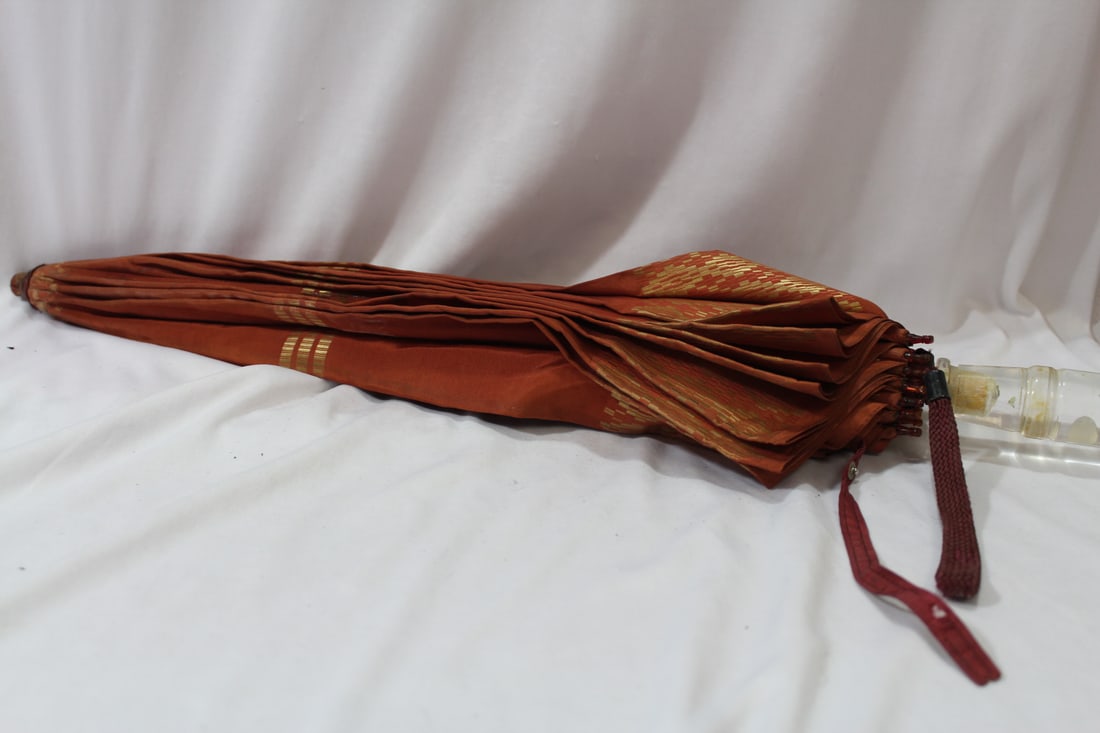 A Lucite Handle Umbrella: 23" long - Umbrella itself worn - but still in pretty good shape for its age