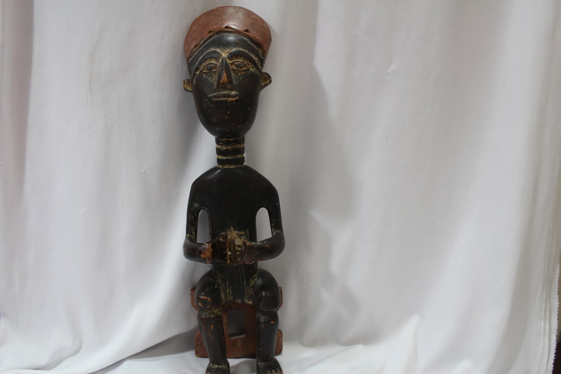 An African Wooden Seated Man: 15 1/4" tall - tribe unkown