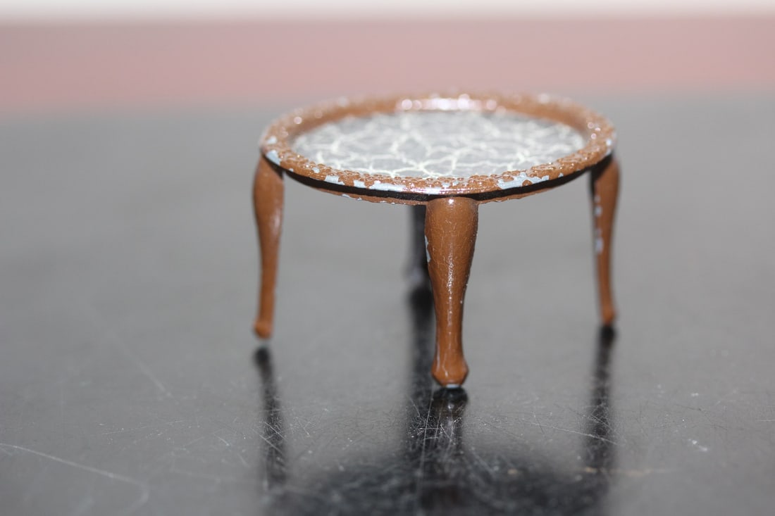 A Metal Doll House Furniture: 1 1/2" across - rare, in vintage metal form