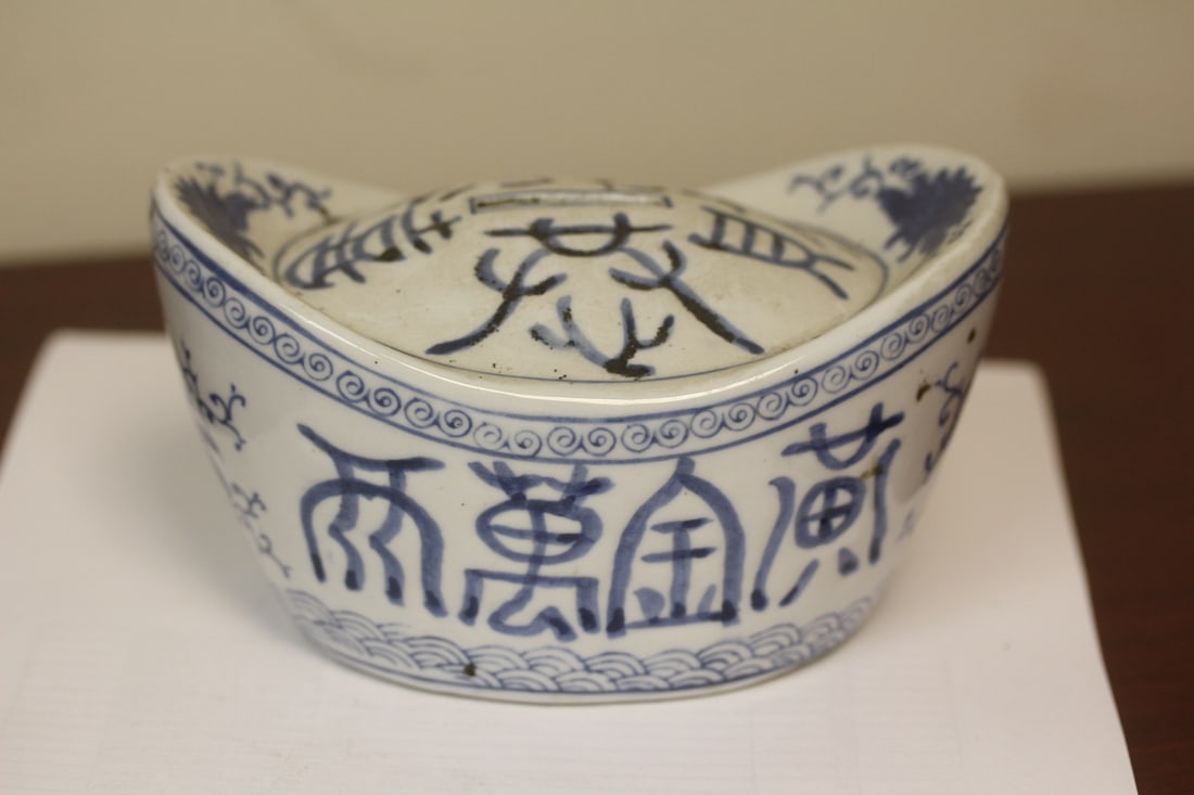 A Chiense Ceramic Blue and White Bank: please note: needs new rubber stopper - 6" across