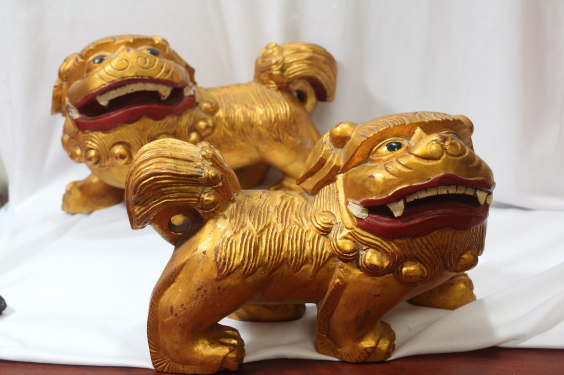 A Pair of Chinese Foo Lions: wooden - gold gilted - 9 1/4" across