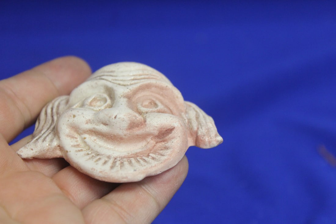 A Small Ceramic Face - 4
