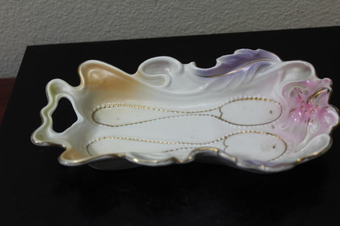 A German Spoon Holder: 7" across