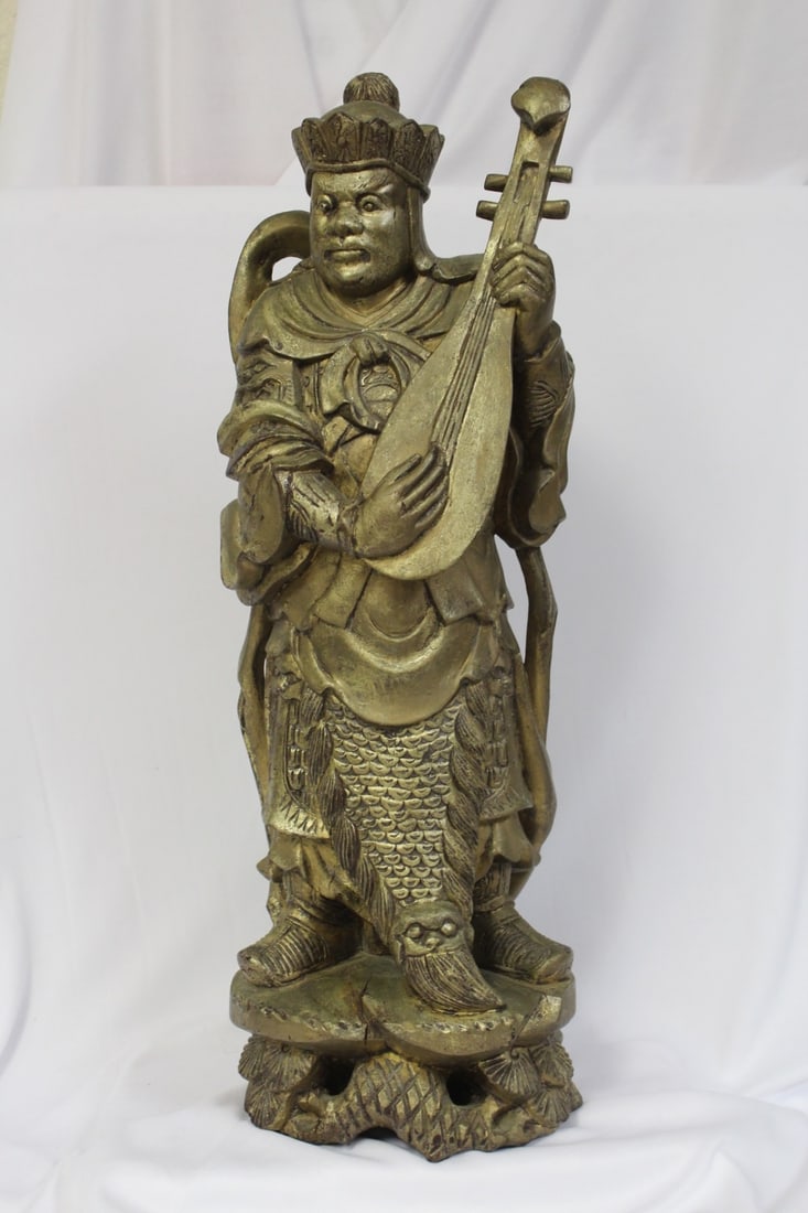 A Gold Gilted Wooden Figure: oriental motif - 19 inches tall - please note: crack - signed on the bottom