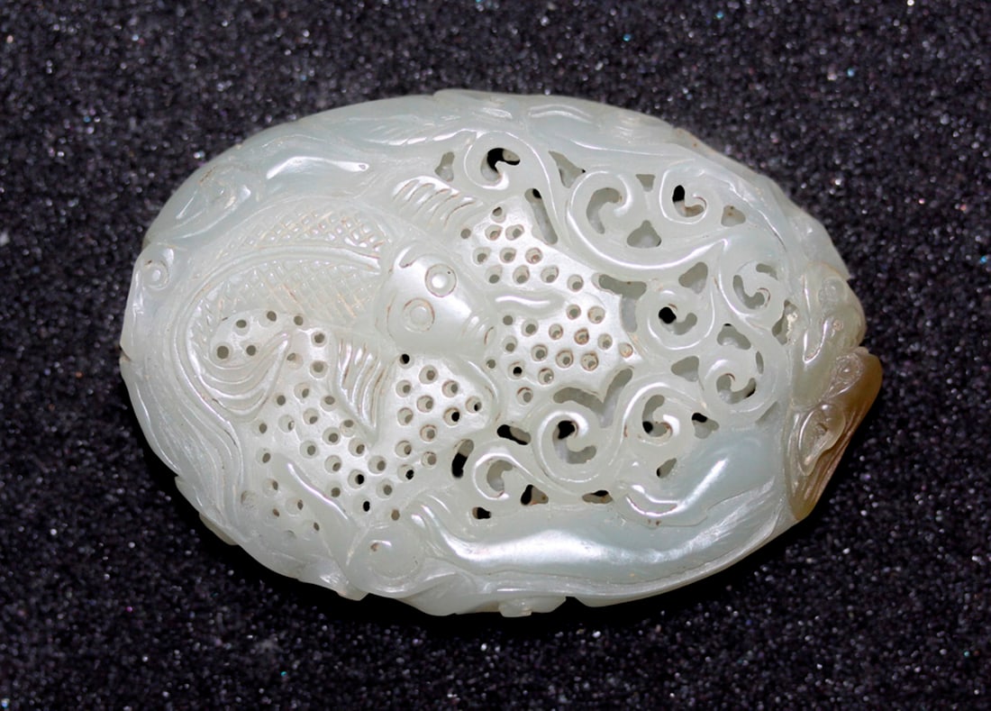 Nicely Carved White Jade Amulet: Circa 19th / 20th century. Amulet is hollow in between. 2 1/8" diameter.