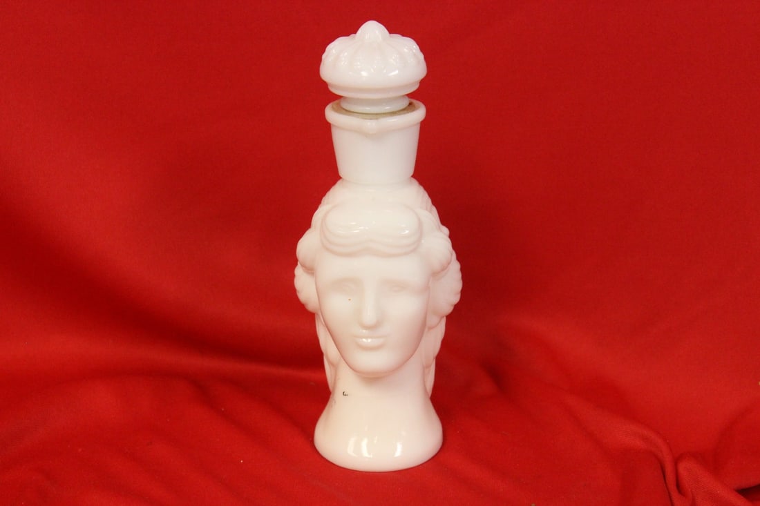 An Avon Milk Glass Parfume Bottle: 6 3/4" tall