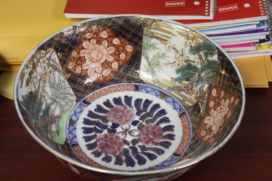 A Vintage Japanese Imari Bowl: signed on the bottom - good size - measures 10 1/2" in diameter - 19th/20th century - bottom shows a couple of crazing