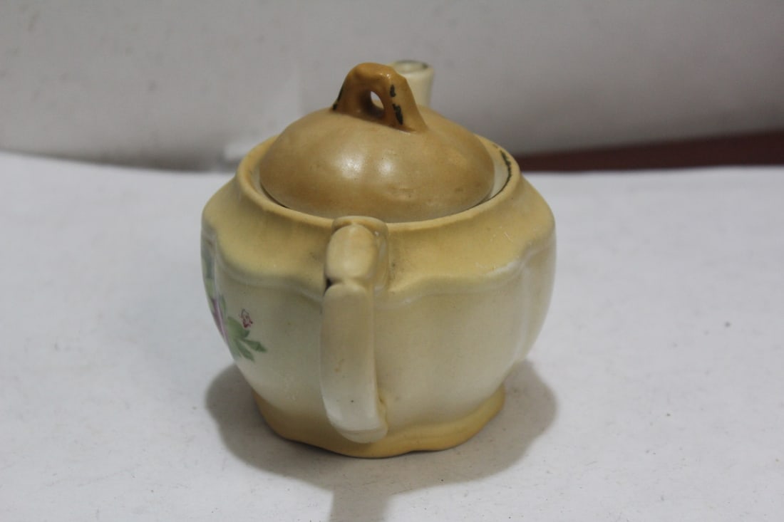 A Small Ceramic Teapot - 4