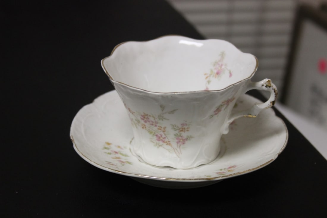 An Antique Weimar, Germany Cup and Saucer: cup= 2 1/2" tall