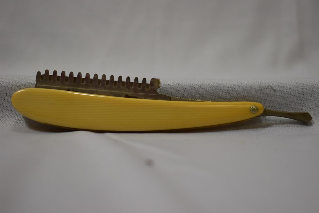 A Durham Domino Celluloid Razor: 5 3/4" long