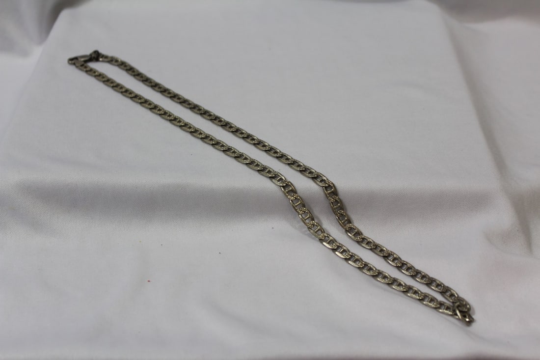 A Diamond Cut Sterling Cut Necklace: 24" long unclasped
